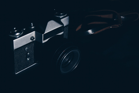 Vintage isolated camera on black backgroundの写真素材