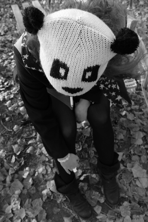 Girl with panda capの写真素材