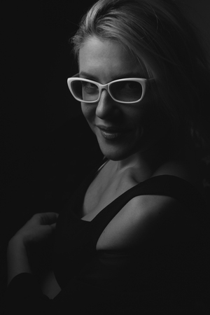 Isolated girl with glasses posingの写真素材