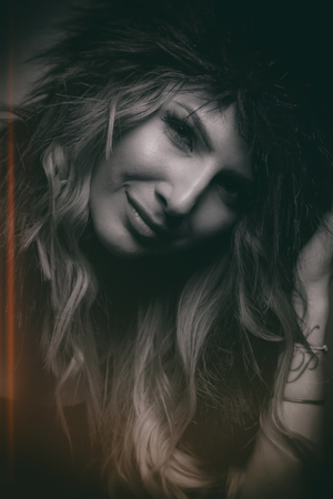 Female Posing in Studio with Women's fur shapkaの写真素材