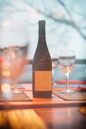 bottle of wine and glasses on the tableの写真素材