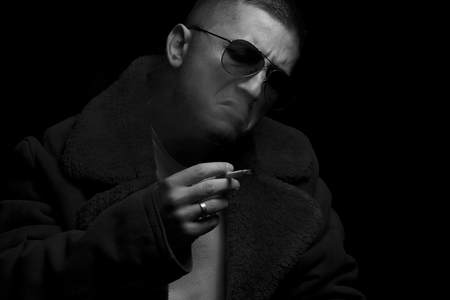 Portrait of a man smoking cigarの写真素材