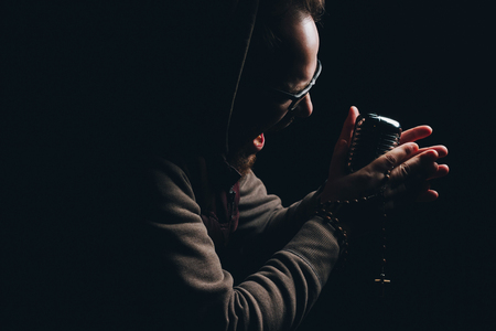 singer singing into vintage microphoneの写真素材