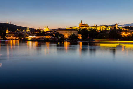 Prague at dusk, view of the Lesser Bridge Tower of Charles Bridge (Karluv Most) and Prague Castle, Czech Republic.のeditorial素材