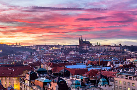 Most mystical and mysterious city in Europe. Prague through the eyes of birds with magnificent sunset and sky over the traditional houses with red roofs. Old town square, Prague, Czech Republicのeditorial素材