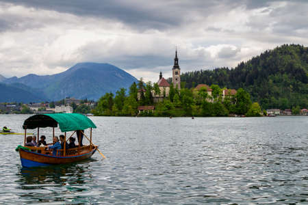 Amazing View On Bled Lake, Island,Church And Castle With Mountain Range (Stol, Vrtaca, Begunjscica) In The Background-Bled, Slovenia, Europeのeditorial素材