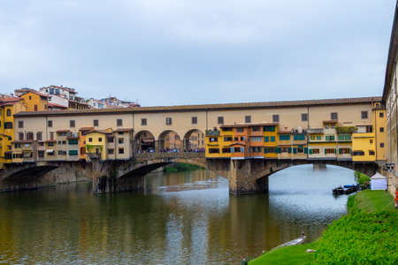 Ponte Vecchio, famous old bridge in Florence on the Arno river, Italyの写真素材