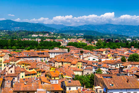 View over Italian town Lucca with typical terracotta roofsの写真素材