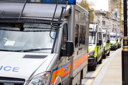 Police vans in a row, London, Britain, UKの写真素材