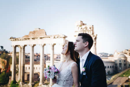 Bride and groom wedding poses in front of Roman Forum, Rome, Italyの写真素材