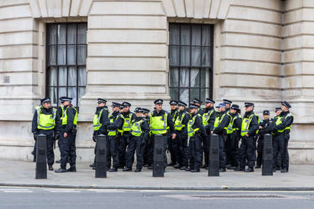 London, UK - 1st April, 2017: Police stand guard on Whitehall street during a protest against Islamists, ISIS. Police were on standby.のeditorial素材