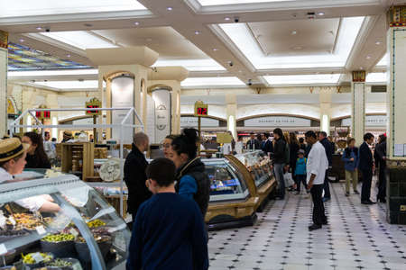 London, England - April 4, 2017: Harrods department store interior, food area with people on April 4, 2017 in London, UK. Harrods is the biggest department store in Europe.のeditorial素材