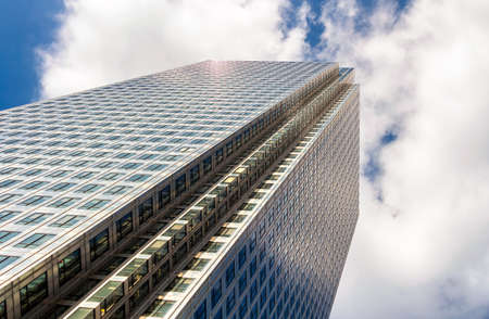 Modern glass exterior of corporate office buildings shot from a low angle.のeditorial素材