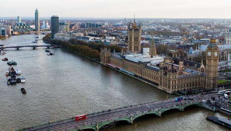 Beautiful panoramic scenic view on London's southern part from window of London Eye tourist attraction wheel cabin: cityscape, Westminster Abbey, Big Ben, Houses of Parliament and Thames riverの写真素材