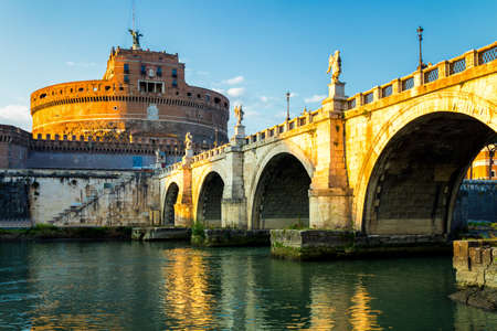 The Mausoleum of Hadrian, usually known as the Castle of the Holy Angel (Castel Sant Angelo) and Ponte Sant'Angelo bridge, a towering cylindrical building in Parco Adriano, Rome, Italyの写真素材