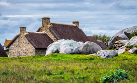 The pink granite rocks with strange shapes, coast in Brittany. The mass of enormous pink rocks, the pink granite, rock with strange shapes. Brittany (Bretagne), Franceの写真素材