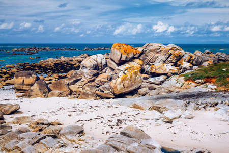 Ocean coast in Meneham village with granite rocks and boats, Kerlouan, Finistere, Brittany (Bretagne), Franceの写真素材