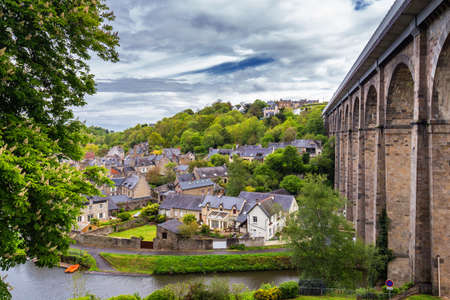 Narrow street with old traditional houses in histoical part of Dinan, Brittany (Bretagne), Franceの写真素材