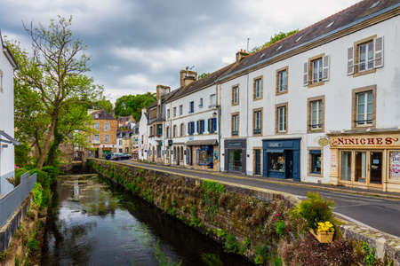 Pont-Aven, France - April 28, 2017: Idyllic scenery at Pont-Aven, street view with small shops, commune in the Finistere department of Brittany (Bretagne) in northwestern Franceのeditorial素材