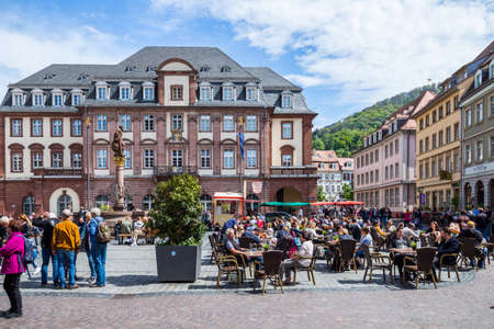 Heidelberg, Germany - May 6, 2017: Marketplace crowded with tourists and Town Hall in Heidelberg in Germany. Heidelberg is a city in Baden-Wurttemberg in Germany.のeditorial素材