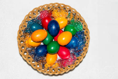 Colorful easter eggs in basket. Happy Easter, Christian religious holiday.