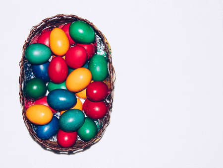 Colorful easter eggs in basket. Happy Easter, Christian religious holiday.の写真素材