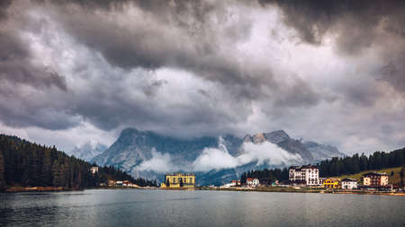 Misurina Lake in the Dolomites mountains in Italy near Auronzo di Cadore on a cloudy day, Sorapiss mountain in the background. South Tyrol, Dolomites, Italy.の写真素材