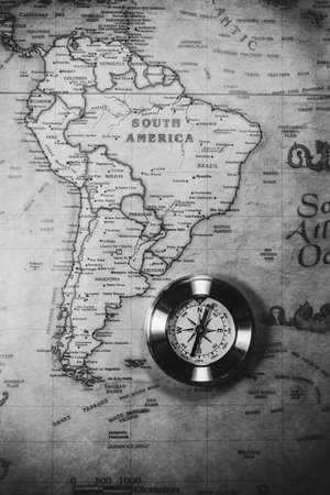 Travel concept background, vintage compas and old earth map
