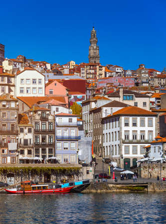 Colorful houses of Porto Ribeira, traditional facades, old multi-colored houses with red roof tiles on the embankment in the city of Porto, Portugalの写真素材