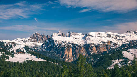 Beautiful winter panorama with fresh powder snow. Landscape with spruce trees, blue sky with sun...