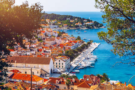 View at amazing archipelago with boats in front of town Hvar, Croatia. Harbor of old Adriatic island town Hvar. Popular touristic destination of Croatia. Amazing Hvar city on Hvar island, Croatia.の写真素材