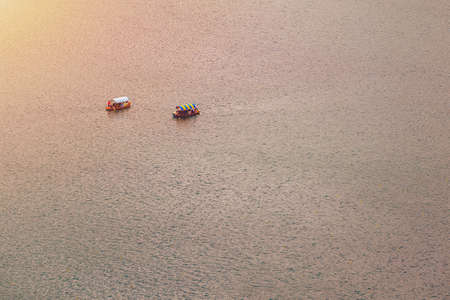Lake Bled, Slovenia. Top view of a boat sailing in the lake. Bled lake is the most famous lake in...