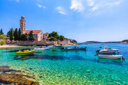 View at amazing archipelago with boats in front of town Hvar, Croatia. Harbor of old Adriatic island town Hvar. Popular touristic destination of Croatia. Amazing Hvar city on Hvar island, Croatia.の写真素材