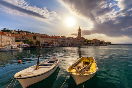 Fishing boat anchoring in beautiful Sutivan port, Brac island, Croatia. Sutivan on Island Brac in...