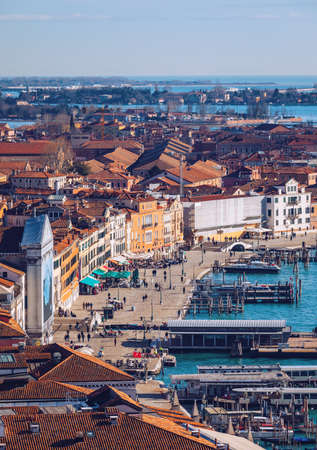 Venice panoramic aerial view with red roofs, Veneto, Italy. Aerial view with dense medieval red roofs of Venice, Italyの写真素材