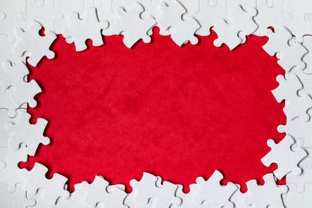 Framing in the form of a rectangle, made of a white jigsaw puzzle. Frame text and jigsaw puzzles....