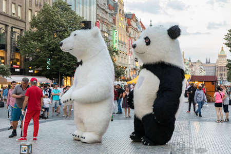 Prague, Czech Republic - May 26, 2018: Men dancing in a Polar bear and Panda bear fancy dress costumes entertains a crowd of people in Wenceslas Square. Prague, Czechia.のeditorial素材