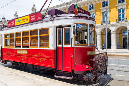 Lisbon, Portugal - June 8, 2018: Famous tram 28 full of tourists in Lisbon, Alfama district, Portugal in a summer day. Colorful tram through the historical streets of Lisbon, Portugal.のeditorial素材