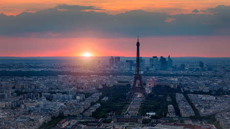 View of Paris with Eiffel Tower from Montparnasse building. Eiffel tower view from Montparnasse at sunset, view of the Eiffel Tower and La Defense district in Paris, France.の写真素材