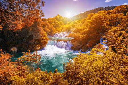 Krka national park with autumn colors of trees, famous travel destination in Dalmatia of Croatia. Krka waterfalls in the Krka National Park in autumn, Croatia.の写真素材