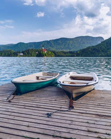 Lake Bled Slovenia. Beautiful mountain Bled lake with small Pilgrimage Church. Most famous Slovenian lake and island Bled with Pilgrimage Church of the Assumption of Maria. Bled, Slovenia.の写真素材