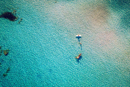 Aerial drone shot of beautiful turquoise beach with pink sand Elafonissi, Crete, Greece. Best beaches of Mediterranean, Elafonissi beach, Crete, Greece. Famous Elafonisi beach on Greece island, Crete.の写真素材