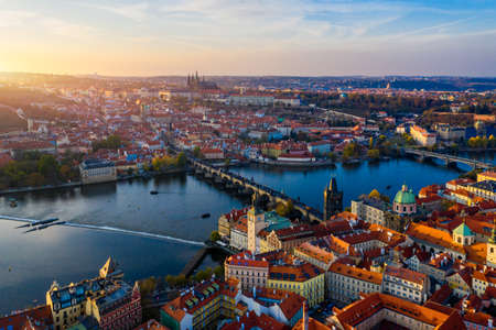Aerial Prague panoramic drone view of the city of Prague at the Old Town Square, Czechia. Prague Old Town pier architecture and Charles Bridge over Vltava river in Prague at sunset, Czech Republic.のeditorial素材