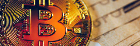 Golden bitcoin over Euro money. Bitcoin cryptocurrency. Crypto currency concept. Bitcoin with euro...