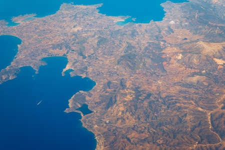View On Adriatic From Plane. Traveling, Holiday, Vacation Concept. View from airplane on Earth surface. Landscape view of islands from the airplane. Greece Islands From Airplaneの写真素材