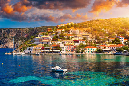 Assos village in Kefalonia, Greece. Turquoise colored bay in Mediterranean sea with beautiful colorful houses in Assos village in Kefalonia, Greece, Ionian island, Cephalonia, Assos village.の写真素材