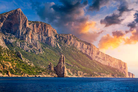 The monolith of Pedra Longa, Baunei, province of Ogliastra, East Sardinia, Italy. The rocky spire which rises majestically out of the sea. Holidays in Sardinia, Italy.の写真素材