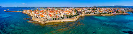 Aerial view over Alghero old town, cityscape Alghero view on a beautiful day with harbor and open...
