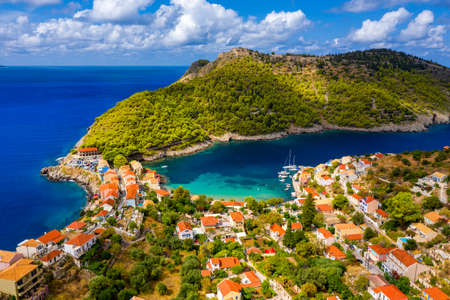 Aerial drone view video of beautiful and picturesque colorful traditional fishing village of Assos in island of Cefalonia, Ionian, Greece. Peninsula of Assos in Cephalonia (Kefalonia), Greeceの写真素材