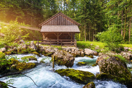 The Gollinger Mill at the Gollinger Waterfall in Golling, Salzburg, Austria. An old water mill near Gollinger waterfall south of Salzburg.の写真素材